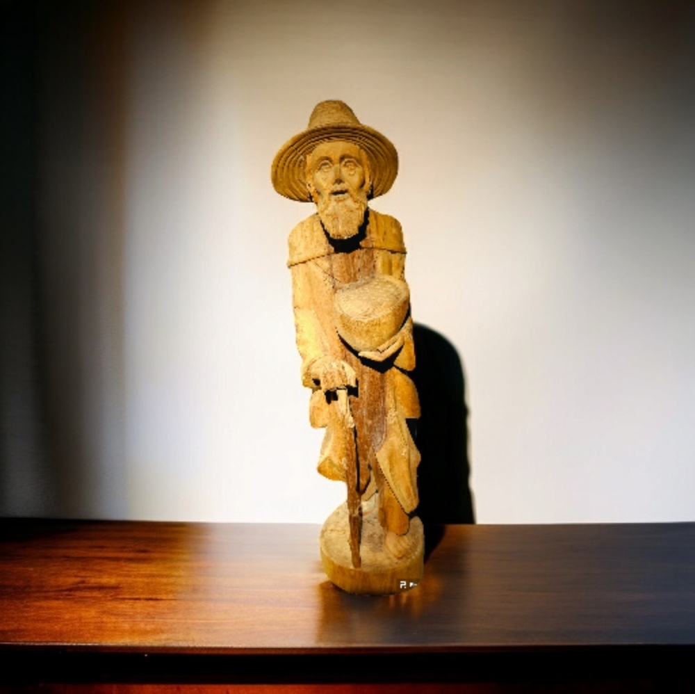 Handcrafted solid piece of wood elderly man